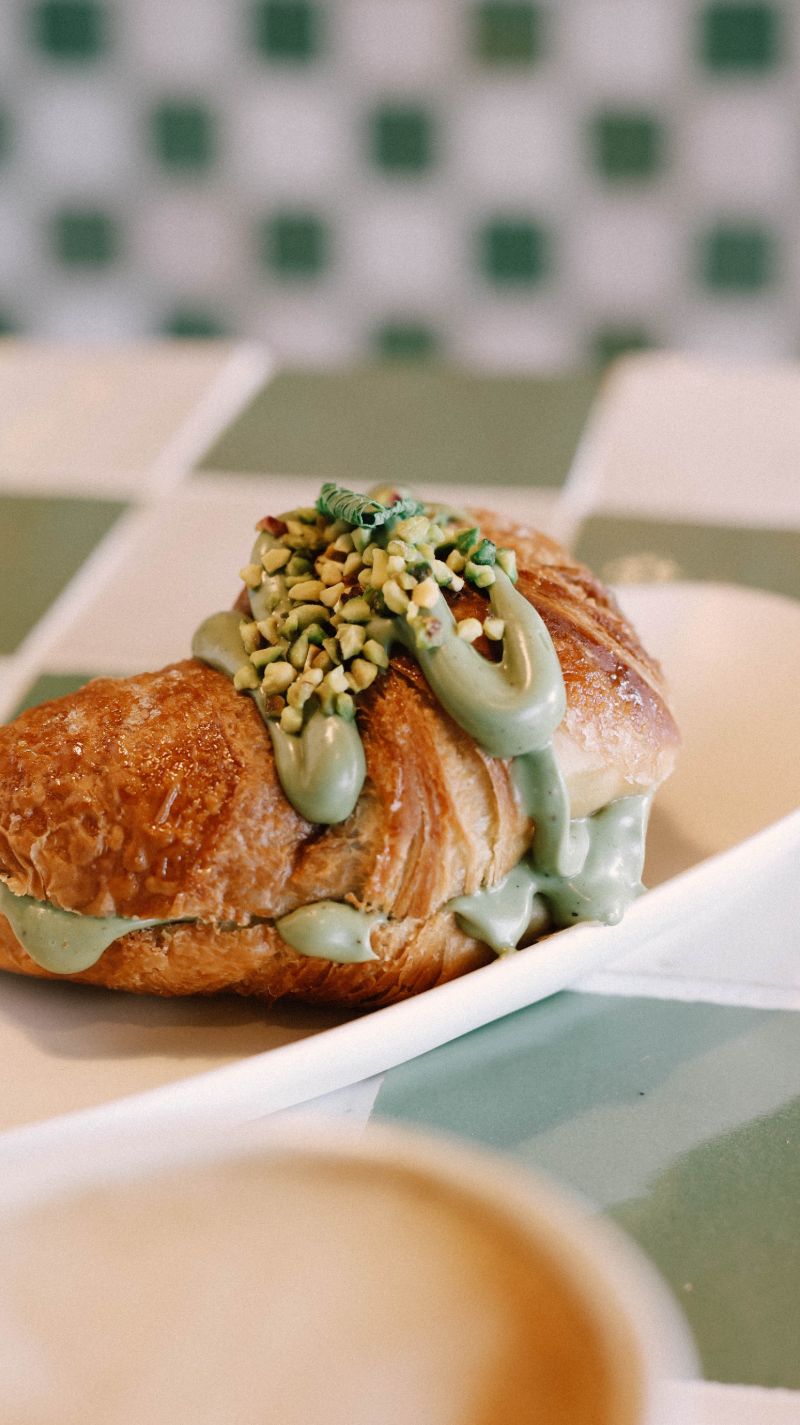 Croissant filled with pistachio cream and crushed pistachios